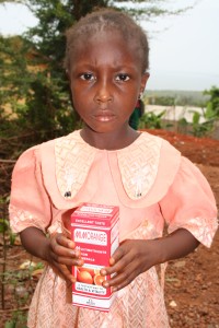 Fatmata Kargbo With Box of Vitamin Supplements
