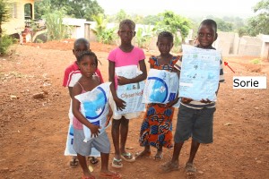 Sorie - on right  - happily holding his new net