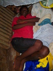 Maco lying on his mat under his new net