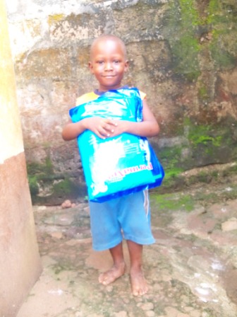 A smiling Morlai holds his new net