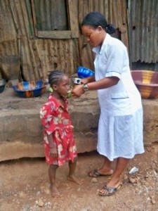 Nurse shows Marie how to take supplements