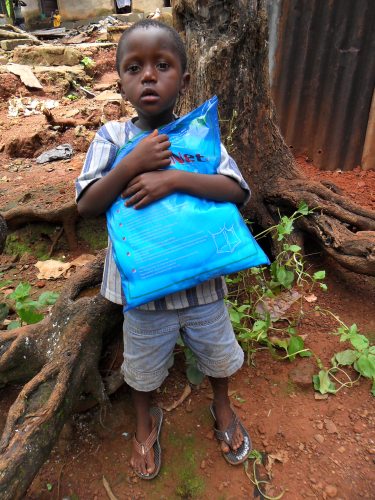 Emanuel hugs the prized gift.