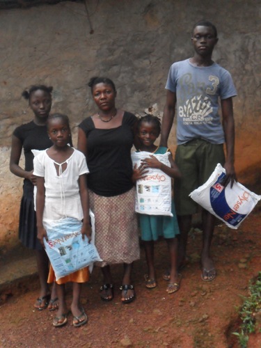 Mariatu, Nancy, Isatu, Mbalu, and Alfred showing off their new nets!